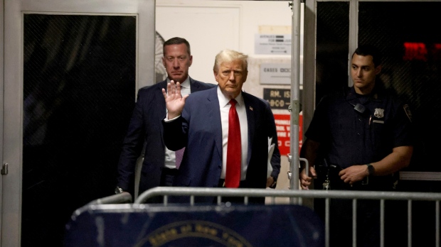 Former U.S. President Donald Trump returns to Manhattan criminal court after a break from his trial in New York, Thursday, April 25, 2024. (Jefferson Siegel/The New York Times via AP, Pool) 