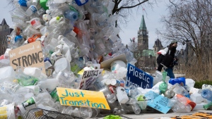 A person walks past a public art installation outside a United Nations conference on plastics, April 23, 2024, in Ottawa. THE CANADIAN PRESS/Adrian Wyld