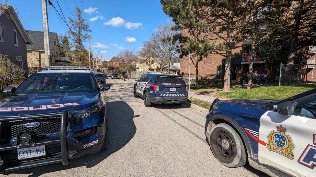 Police cruisers are pictured near the corner of College and Ahrens streets in Kitchener on April 25, 2024. (Dan Lauckner/CTV Kitchener)