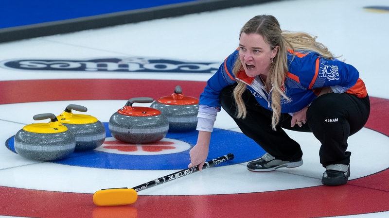 Wild Card 2 skip Chelsea Carey directs the sweep as they play Prince Edward Island at the Scotties Tournament of Hearts at Fort William Gardens in Thunder Bay, Ont. on Wednesday, Feb. 2, 2022. (THE CANADIAN PRESS/Andrew Vaughan)