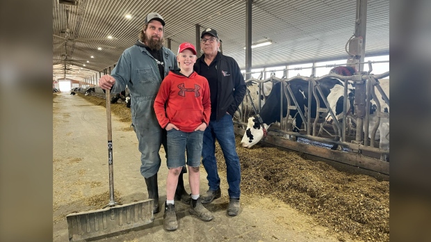 Arjo, Jake and Adam Van Bergeijk represent three generations of dairy farmers who would be affected if the Wilmot land assembly project goes ahead. (CTV News/Stefanie Davis)
