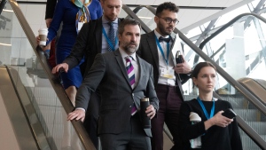 Minister of Environment and Climate Change Steven Guilbeault leaves a news conference at the Intergovernmental Negotiating Committee with staff , Tuesday, April 23, 2024 in Ottawa. THE CANADIAN PRESS/Adrian Wyld