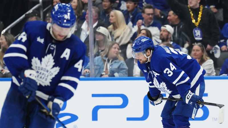 Toronto Maple Leafs' Auston Matthews (34) and Morgan Rielly (44) react after Boston Bruins' Brad Marchand scored an empty-net goal during third period action in Game 3 of an NHL hockey Stanley Cup first-round playoff series in Toronto on Wednesday, April 24, 2024. THE CANADIAN PRESS/Nathan Denette