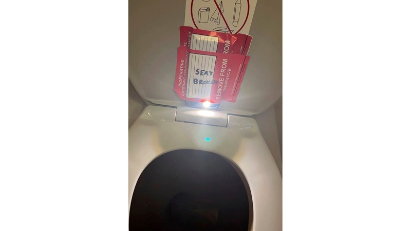 In this photo provided by the law firm Lewis & Llewellyn LLP, an iPhone is taped to the back of a toilet seat on an American Airlines flight from Charlotte, N.C., to Boston, Sept. 2, 2023. (Lewis & Llewellyn LLP via AP, File)