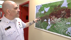 Halifax assistant fire chief Scott Ramey points to map that shows the area covered by the Upper Tantallon wildfire. 