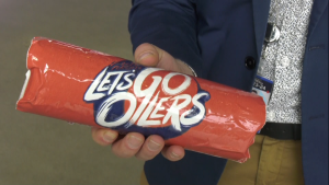 Oilers Entertainment Group in-game presentation director Lindsey Gullett holds an Oilers-branded donair on April 26, 2024. (Jeremy Thompson/CTV News Edmonton)