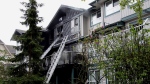 Surrey RCMP arrested a 22-year-old man after a suspicious fire at a townhouse complex in Newton on April 26, 2024. (CTV News)