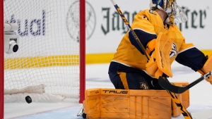 Nashville Predators goaltender Juuse Saros (74) lets a Vancouver Canucks shot on goal get past for a score during the first period in Game 3 of an NHL hockey Stanley Cup first-round playoff series Friday, April 26, 2024, in Nashville, Tenn. (AP / George Walker IV)
