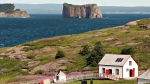 Tens of thousands of visitors flock to Quebec's storied Iles-de-la-Madeleine every summer to behold its cliff-framed seascapes and wide sandy beaches. But starting next month, those island sojourns will come with an added cost. The Bonaventure Island is shown overlooking the Perce rock on July 25, 2012. THE CANADIAN PRESS/Jacques Boissinot
