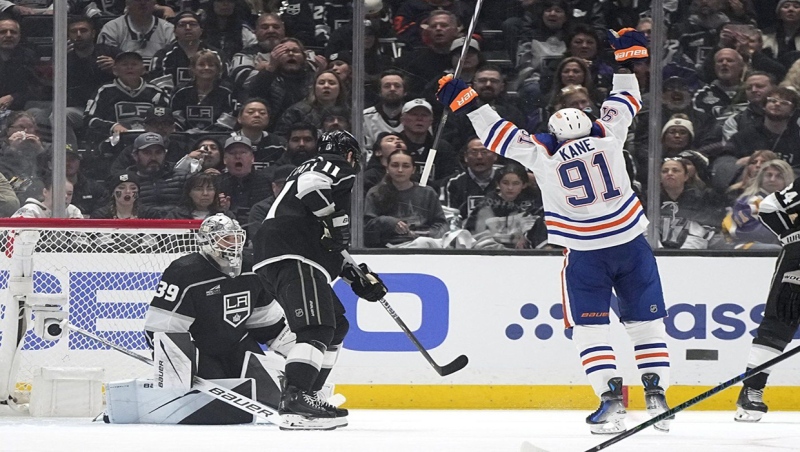 Edmonton Oilers left wing Evander Kane, right, celebrates his goal as Los Angeles Kings goaltender Cam Talbot, left, and center Anze Kopitar look on during the second period in Game 3 of an NHL hockey Stanley Cup first-round playoff series Friday, April 26, 2024, in Los Angeles. (AP Photo/Mark J. Terrill)