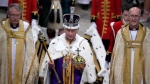 Britain's King Charles III, center, walks in the Coronation Procession after his coronation ceremony at Westminster Abbey in London, May 6, 2023. (AP Photo/Kirsty Wigglesworth, Pool, File)
