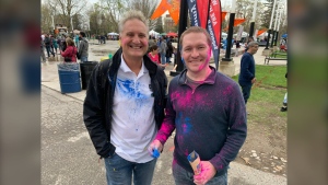 Coun. Steve Lehman and Mayor Josh Morgan are seen getting into the spirit at the Holi Festival of Colours at Victoria Park in London, Ont. on April 27, 2024. (Bryan Bicknell/CTV News London)