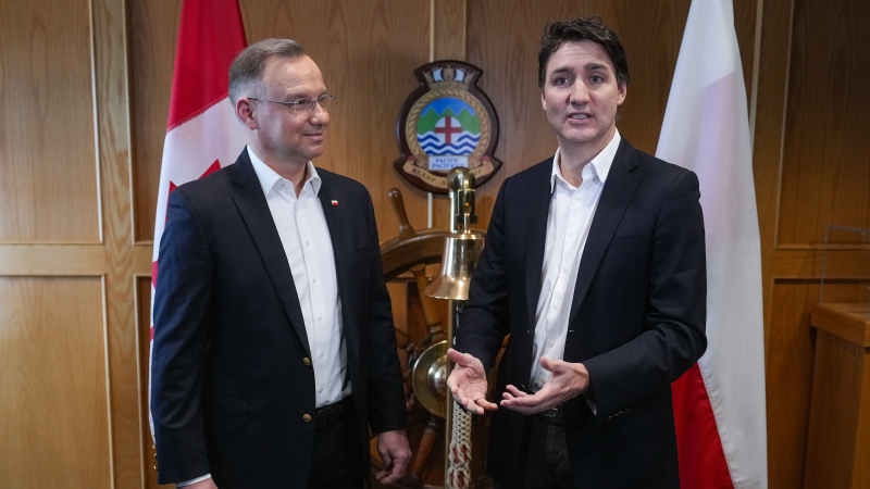 Prime Minister Justin Trudeau, right, speaks while welcoming Poland President Andrzej Duda to Canadian Forces Base Esquimalt, in Esquimalt, B.C., on Saturday, April 20, 2024. THE CANADIAN PRESS/Darryl Dyck 