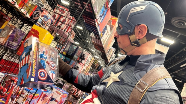 Captain America took a few moments out of walking the floor on Day 3 of the Calgary Comics and Entertainment Expo, to check out a piece of namesake merchandise at the Redd Skull Comics booth. (Damien Wood/CTV Calgary)