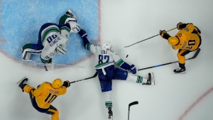 Vancouver Canucks defenseman Ian Cole (82) and goaltender Casey DeSmith (29) defend the goal against Nashville Predators center Ryan O'Reilly (90) and center Colton Sissons (10) during the third period in Game 3 of an NHL hockey Stanley Cup first-round playoff series Friday, April 26, 2024, in Nashville, Tenn. The Canucks won 2-1. (AP Photo/George Walker IV)