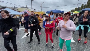 People dance at the Lapu-Lapu Day Block Party in South Vancouver on Saturday, April 27. 