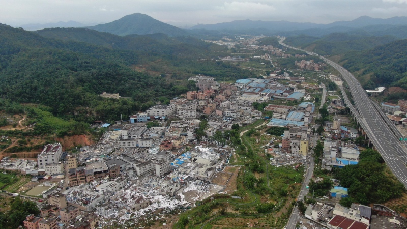 In this photo provided by China's Xinhua News Agency, an aerial view shows damaged buildings in the aftermath of a tornado in Guangming Village of Zhongluotan Town, Baiyun District, Guangzhou, south China's Guangdong Province, Sunday, April 28, 2024.(Deng Hua/Xinhua via AP)