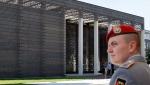 FILE - A soldier is seen in front of the 'Military Memorial of the German Bundeswehr' in Berlin Germany, Tuesday, Sept. 8, 2009. (AP Photo/Michael Sohn, File)