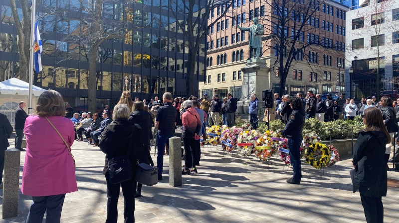 Groups of people gather at province house in Nova Scotia to honour the National Day of Mourning. (CTV/Hafsa Arif)