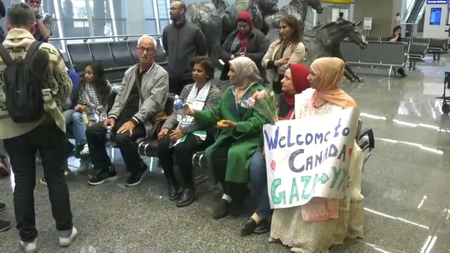 Palestinian families greet family from Gaza at YYC