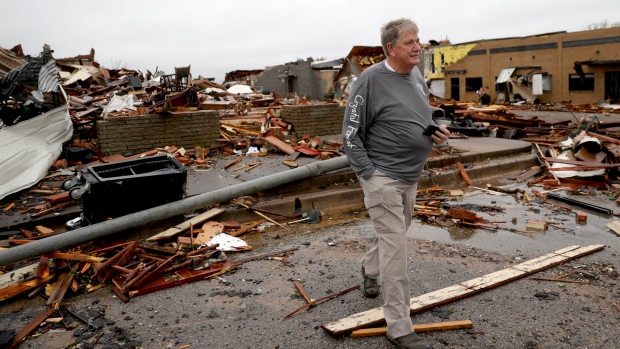 Charlie Schwake walks past his property in Sulphur after a tornado hit the area the night before in Sulphur, Okla., Sunday, April 28, 2024. (Bryan Terry/The Oklahoman via AP)