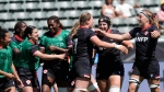 Canada's Sophie de Goede (7) celebrates with teammates after scoring a try against the United States during the second half of a Pacific Four Series women's rugby match, Sunday, April 28, 2024, in Carson, Calif. (AP Photo/Marcio Jose Sanchez)