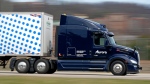 A self-driving tractor-trailer manoeuvres around a test track in Pittsburgh, Thursday, March 14, 2024. (AP Photo/Gene J. Puskar)