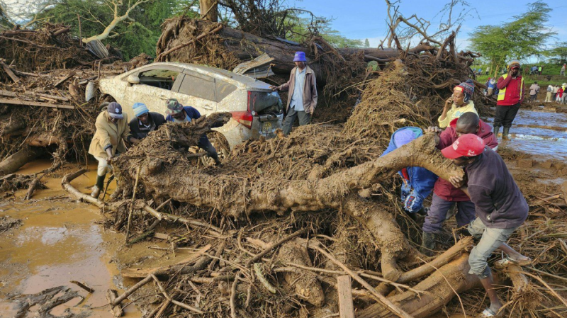 People try to clear the area after a dam burst, in Kamuchiri Village Mai Mahiu, Nakuru County, Kenya, Monday, April 29, 2024. (AP Photo)