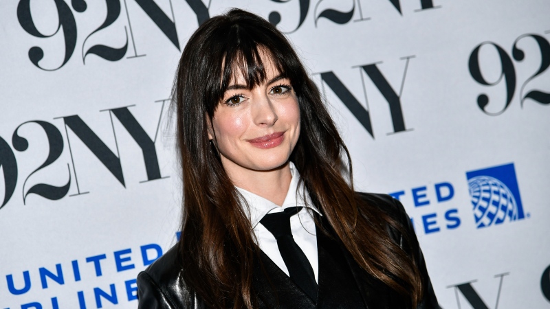 Actor Anne Hathaway poses backstage following a screening of 