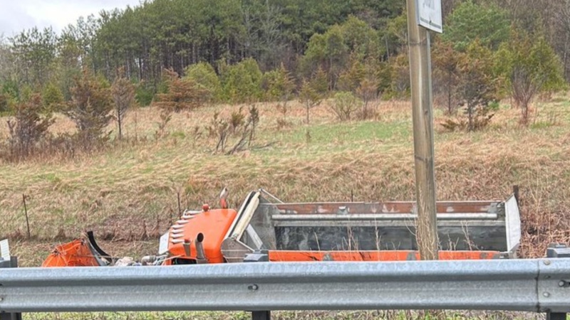 A dump truck is in the ditch after it rolled over Monday, April 29, 2024. (Source: OPP)