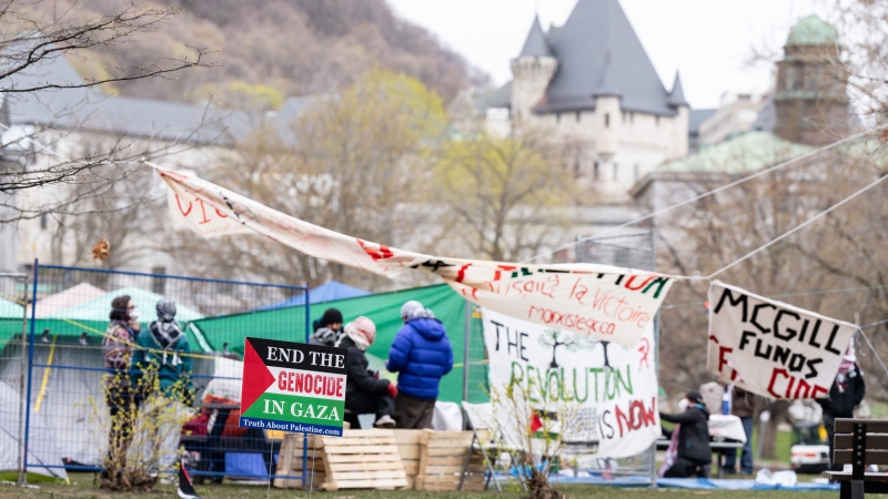 Pro-Palestinian activists are seen in their encampment set up on McGill University's campus in Montreal, Monday, April 29, 2024. THE CANADIAN PRESS/Christinne Muschi
