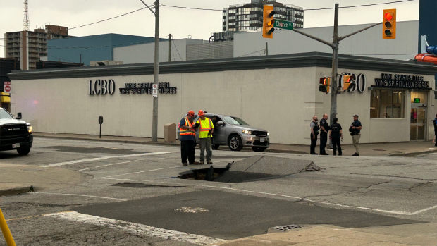 A sinkhole appeared at the corner of University Avenue West and Church Street on April 29, 2024. (Rich Garton/CTV News Windsor) 