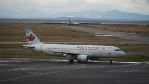 An Air Canada aircraft taxis at Vancouver International Airport in Richmond, B.C., on Monday, December 26, 2022. THE CANADIAN PRESS/Darryl Dyck