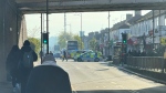 The area in London where police say a man wielding a sword attacked members of the public and two police officers on Tuesday, April 30, 2024 in the east London community of Hainault before being arrested. (Peter Kingdom via AP)
