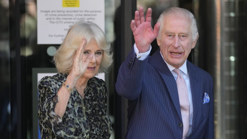 King Charles III and Queen Camilla wave as they arrive for a visit to University College Hospital Macmillan Cancer Centre in London, Tuesday, April 30, 2024. (AP Photo/Kin Cheung)