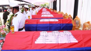 In this photo released by Agence Kampuchea Press (AKP), coffins loaded with Cambodian soldiers who died during an ammunition explosion are prepare before the cremation ceremony in an army base in Kampong Speu province, Cambodia, Sunday, April 28, 2024. (AKP via AP) 