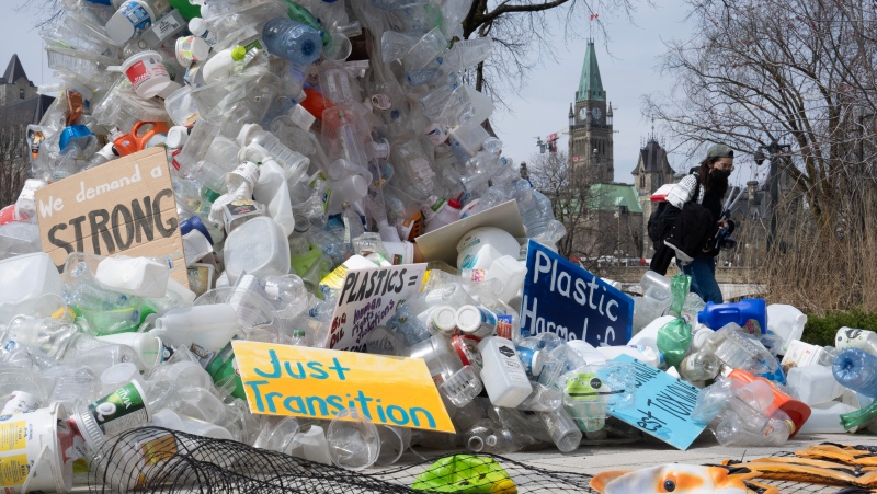 A person walks past a public art installation outside a United Nations conference on plastics on Tuesday, April 23, 2024 in Ottawa. THE CANADIAN PRESS/Adrian Wyld