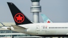 Air Canada planes sit on the tarmac at Pearson International Airport in Toronto on Wednesday, April 28, 2021. THE CANADIAN PRESS/Nathan Denette