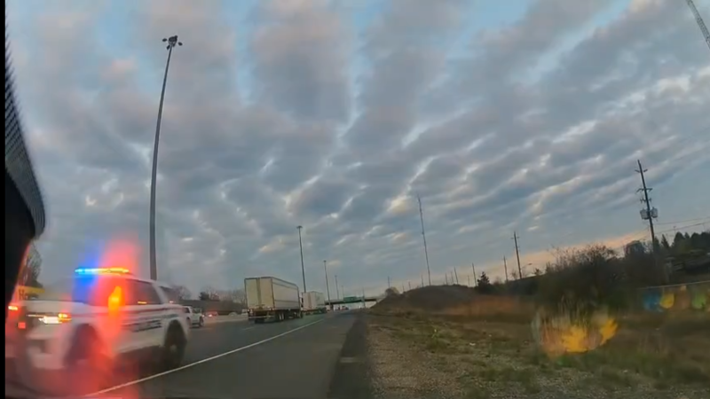 A wrong-way police chase on Highway 401 in Whitby, Ont., captured on a driver's dashcam on April 29, 2024. 