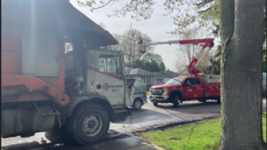 Crews from Bluewater Power are fixing downed power lines in Bright's Grove after they were clipped by a dump truck on April 30, 2024. (Source: Sarnia police)