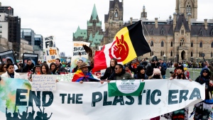 People take part in a 'March to End the Plastic Era' rally on Parliament Hill in Ottawa, on Sunday, April 21, 2024. THE CANADIAN PRESS/Spencer Colby