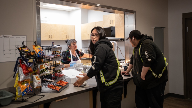 Workers stop for lunch at the arena, one of many amenities and infrastructure projects the community of 700 has been able to finance through relationship with industry, in Fort McKay, Alta., on Thursday April 25, 2024. THE CANADIAN PRESS/Amber Bracken