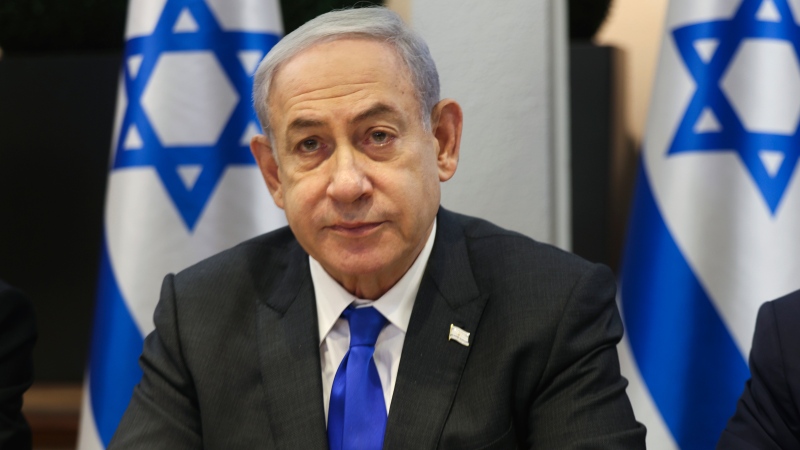 Israeli Prime Minister Benjamin Netanyahu chairs a cabinet meeting at the Kirya, which houses the Israeli Ministry of Defence, in Tel Aviv, Israel, Sunday, Dec. 17, 2023. (Menahem Kahana / Pool Photo via AP)