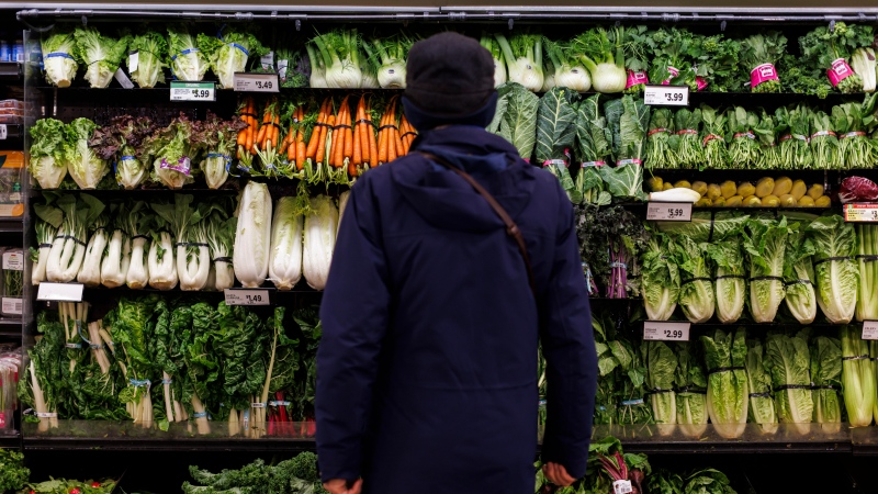 A customer shops in the produce section at a Metro grocery store In Toronto on Friday, Feb. 2, 2024. THE CANADIAN PRESS/Cole Burston 