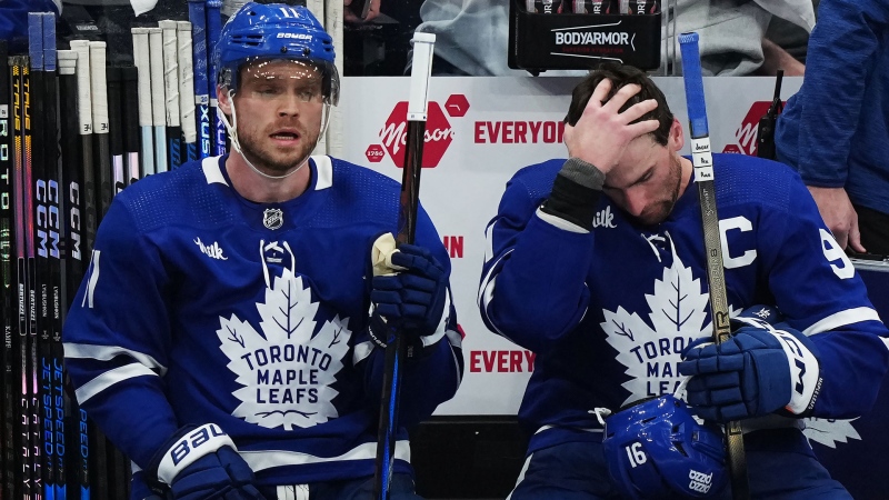 Toronto Maple Leafs' Max Domi, left, and John Tavares react on the bench during third period action against the Boston Bruins in Game 4 of an NHL hockey Stanley Cup first-round playoff series in Toronto on Saturday, April 27, 2024. THE CANADIAN PRESS/Nathan Denette