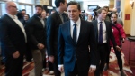 Surrounded by staff, Conservative leader Pierre Poilievre walks through a hall after delivering a speech to members at the Canada Building Trades Union conference, Tuesday, April 30, 2024 in Gatineau, Quebec. (Adrian Wyld / The Canadian Press)