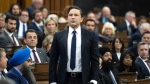Leader of the Conservative Party Pierre Poilievre rises in response to the Speaker asking him to withdraw language during Question Period, Tuesday, April 30, 2024 in Ottawa. (THE CANADIAN PRESS/Adrian Wyld)