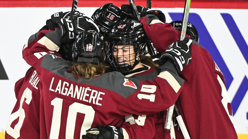Montreal's Sarah Lefort (16) celebrates with teammates after scoring against Minnesota during second period PWHL hockey action in Laval, Que., Sunday, February 18, 2024. (Graham Hughes, The Canadian Press)