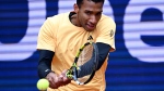 Canada's Felix Auger Aliassime plays a return to Germany's Jan-Lennard Struff during the men's singles quarterfinal match at the ATP Tour in Munich, Germany, Saturday April 20, 2024. (Sven Hoppe/The Associated Press)