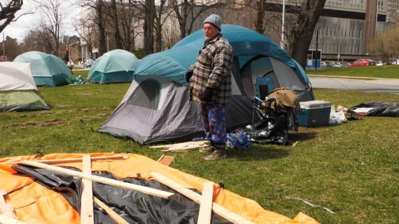 Hans-Eric Gurholt is seen standing outside his tent on University Avenue in Halifax on April 30, 2024. 
